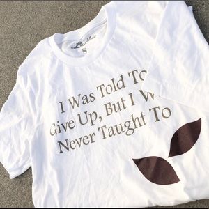 White short sleeves,dark gold wording, soft and comfortable sizing for everyone.